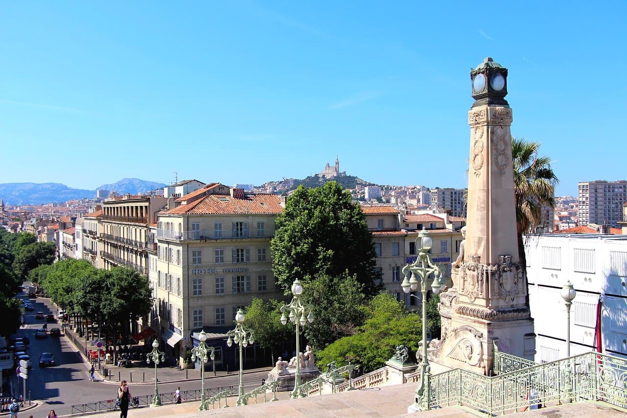 Panoramic view of Marseille harbor with Notre-Dame de la Garde hilltop